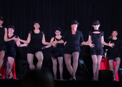 A group of womes doing zumba dance on the stage